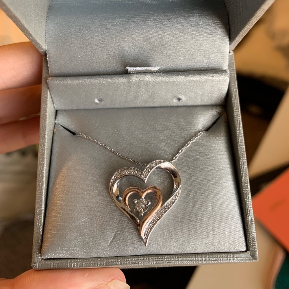 Diamond accent tilted double heart pendant